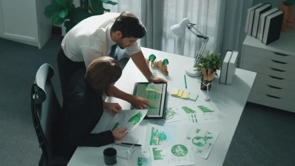 Investor Relations and ESG Reporting Team Analyzing Data and Preparing Transparent Reports